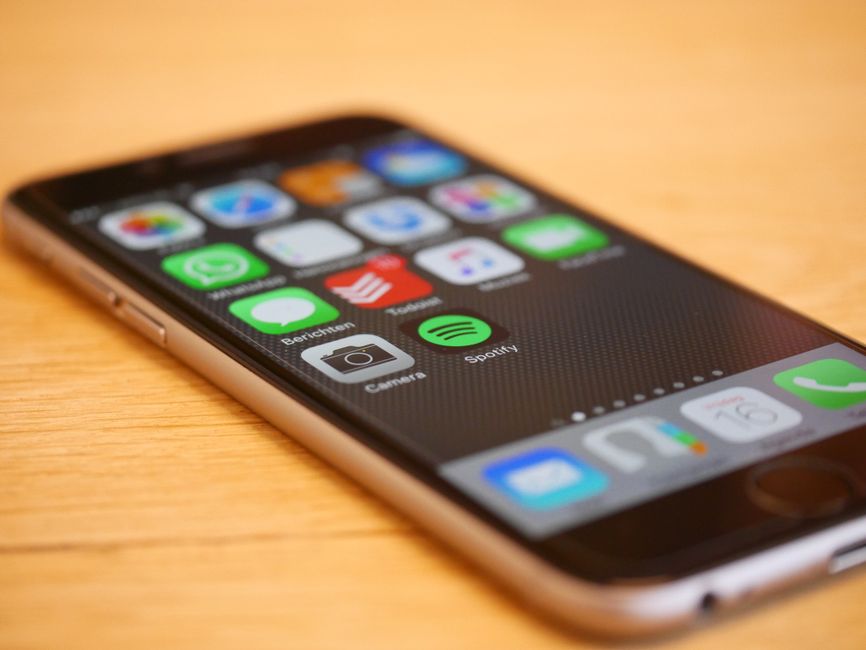 A smartphone displaying a health application is placed next to a sugary breakfast, illustrating the concept of dangerously incorrect AI dietary recommendations for insulin resistance.